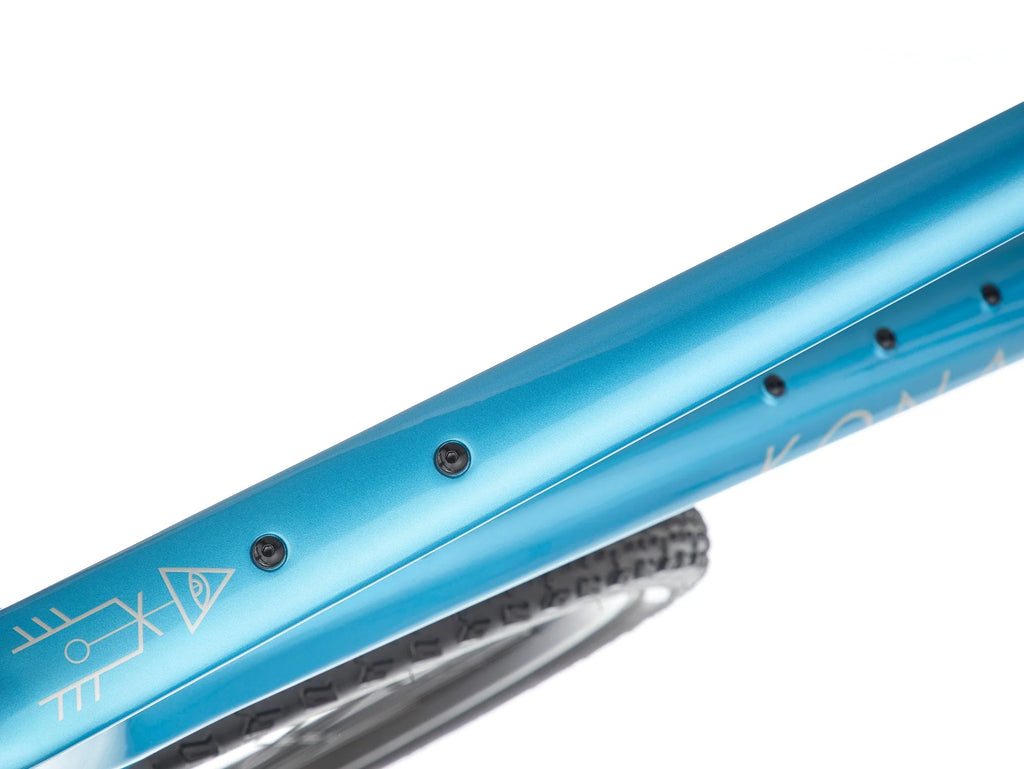 Close-up of a blue bicycle frame with visible branding on a white background