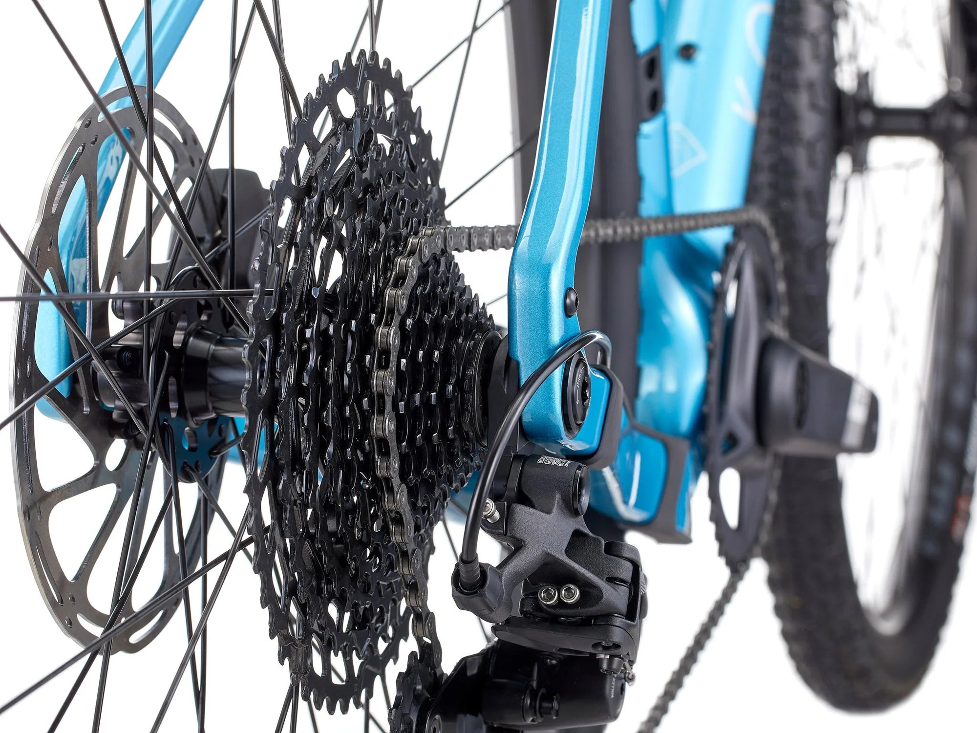 Close-up of a bicycle's gear system with a blue frame.