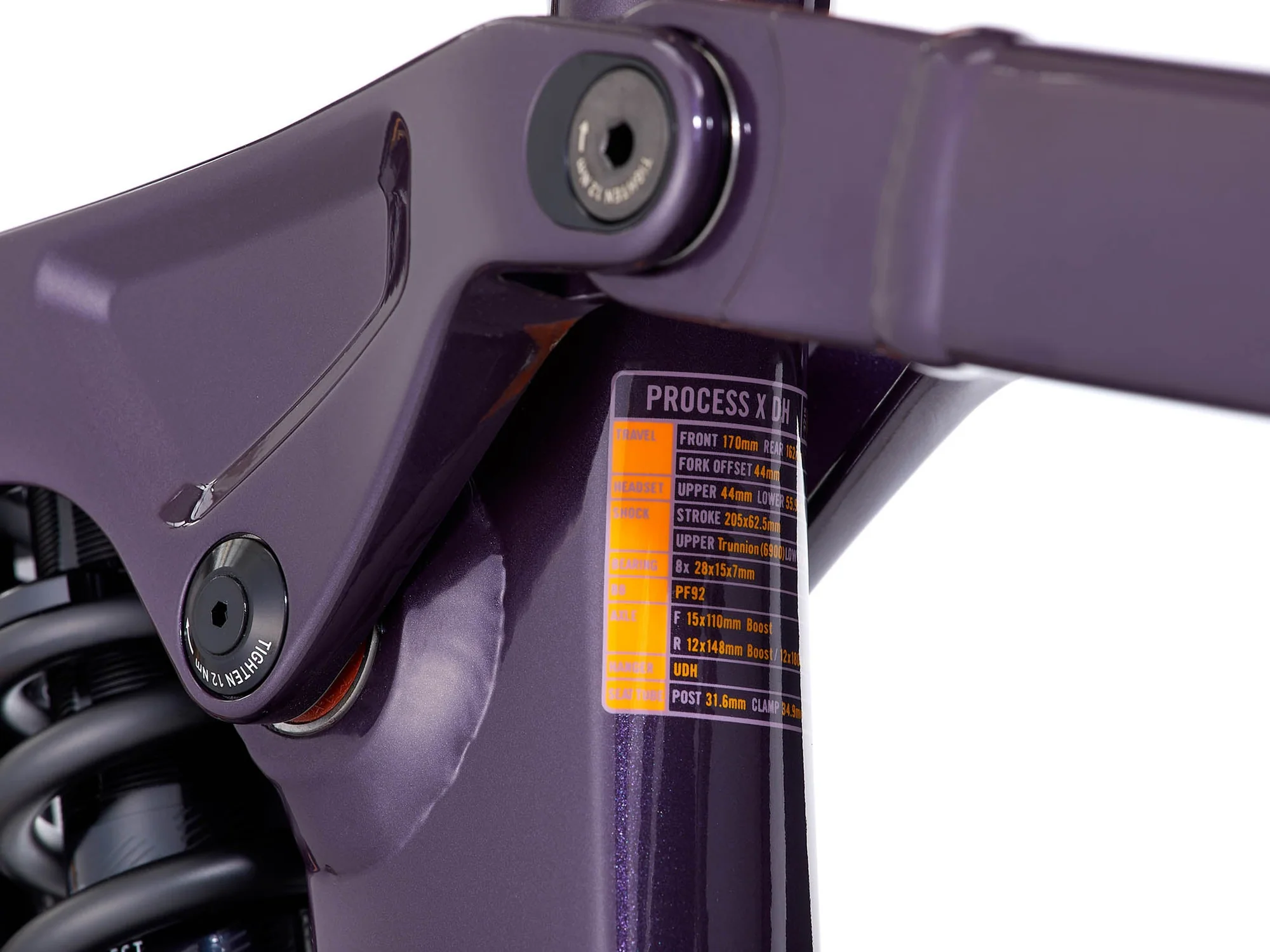 Close-up of a purple bicycle frame with a label on a white background