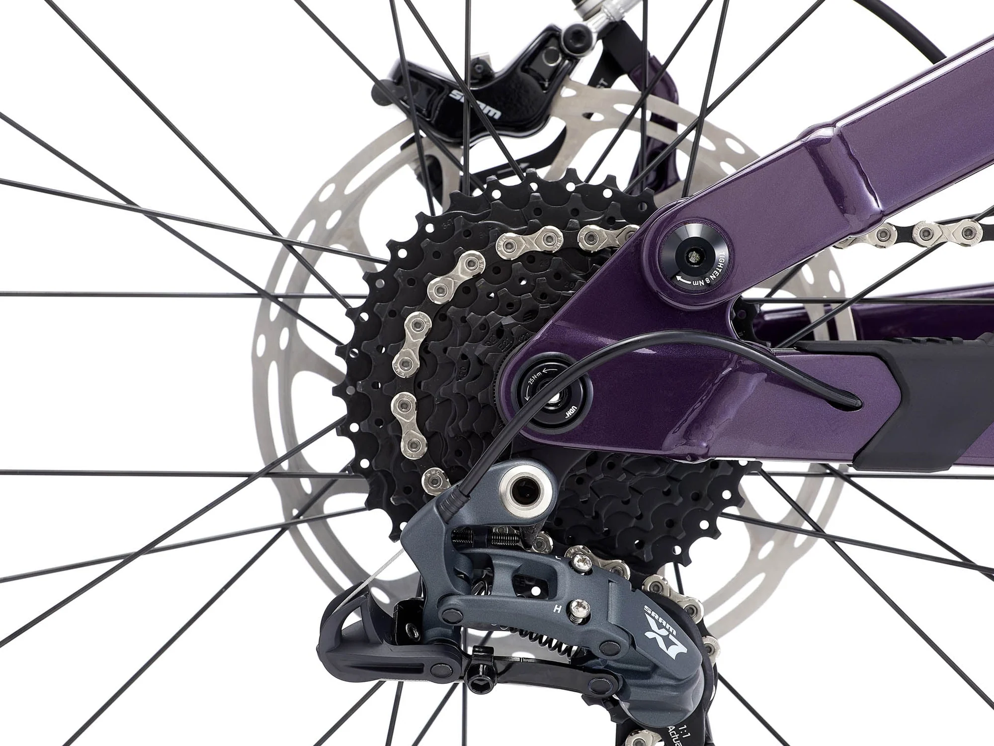 Close-up of a bicycle's gear system with a purple derailleur on a white background