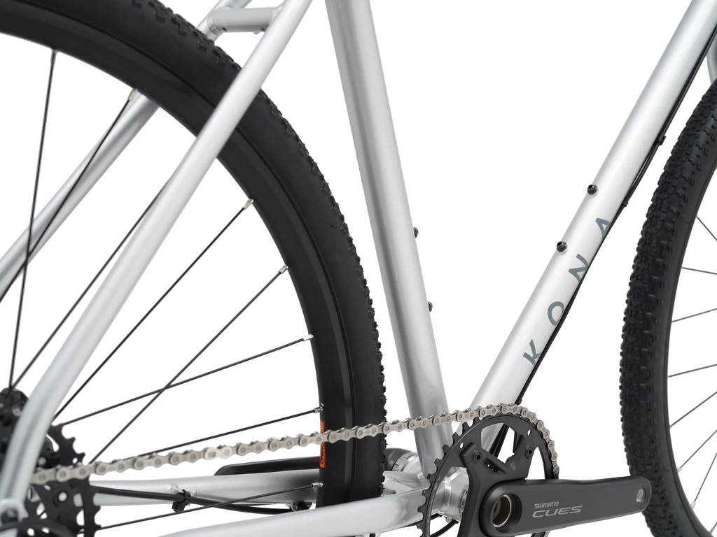Close-up of a bicycle chain and gear system on a white background