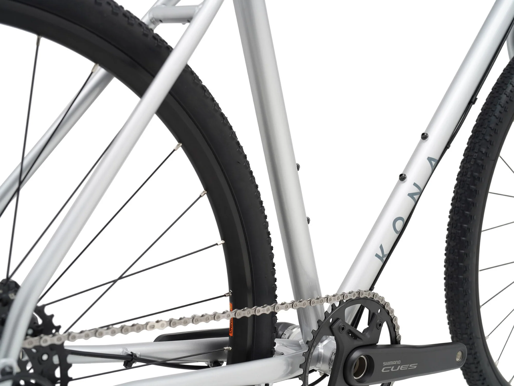 Close-up of a bicycle chain and gear system on a white background