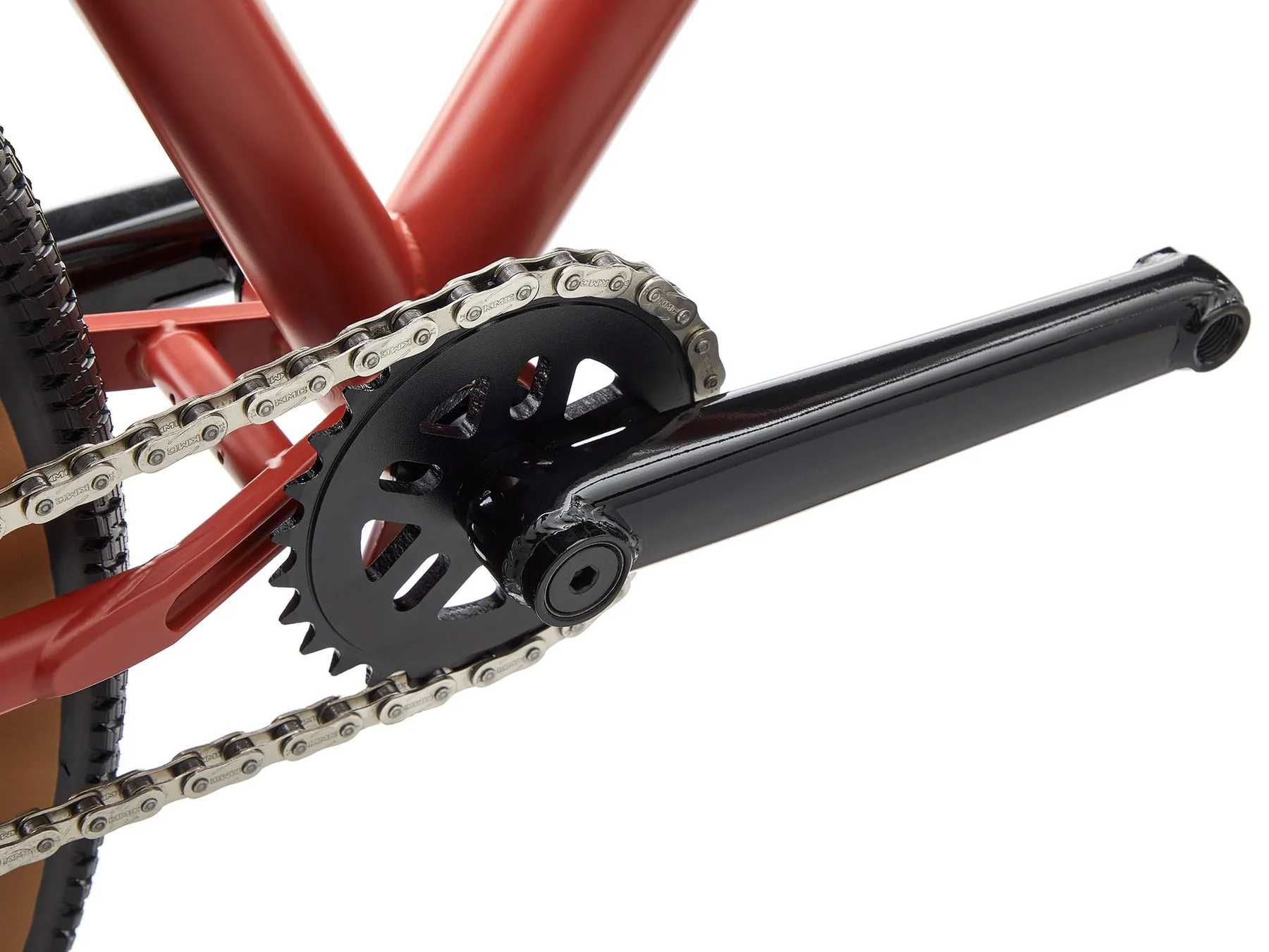 Close-up of a bicycle chain and gear system on a white background
