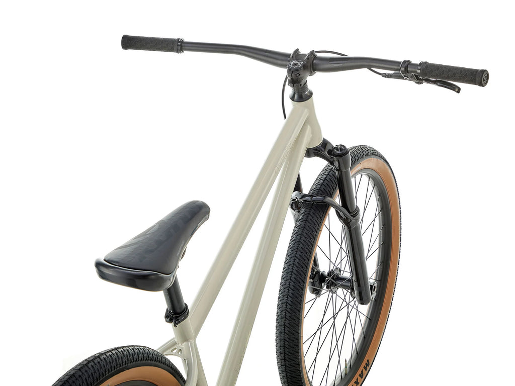 Close-up of a bicycle frame, handlebars, saddle, and front wheel against a clean white background.