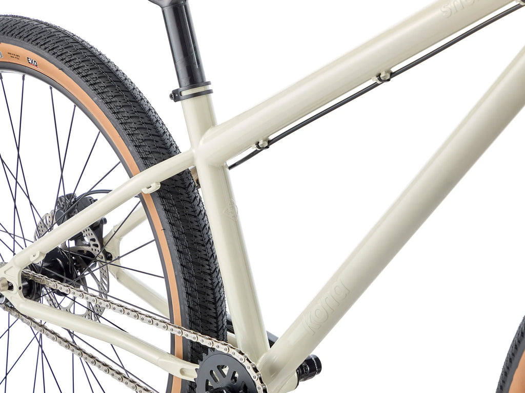 Close-up of a bicycle frame and wheel on a white background