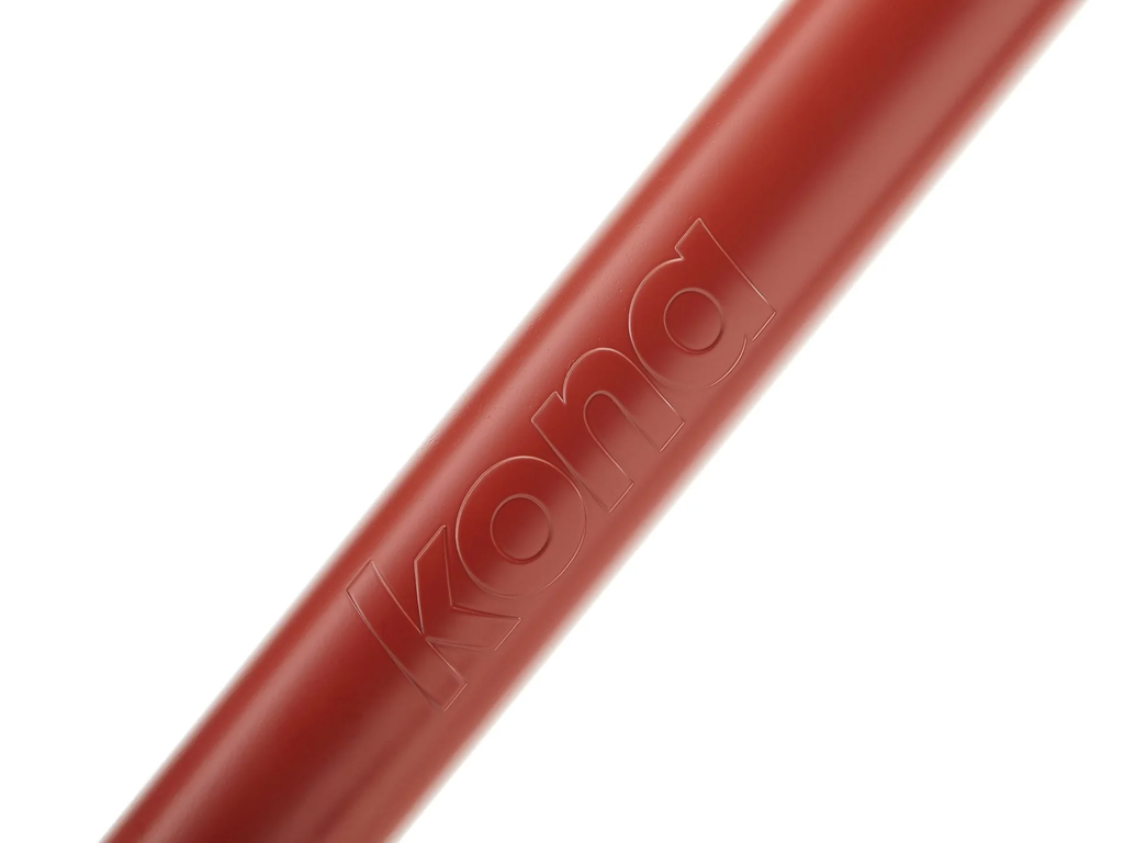 Close-up of a red bicycle handlebar with 'Kona' branding on a white background
