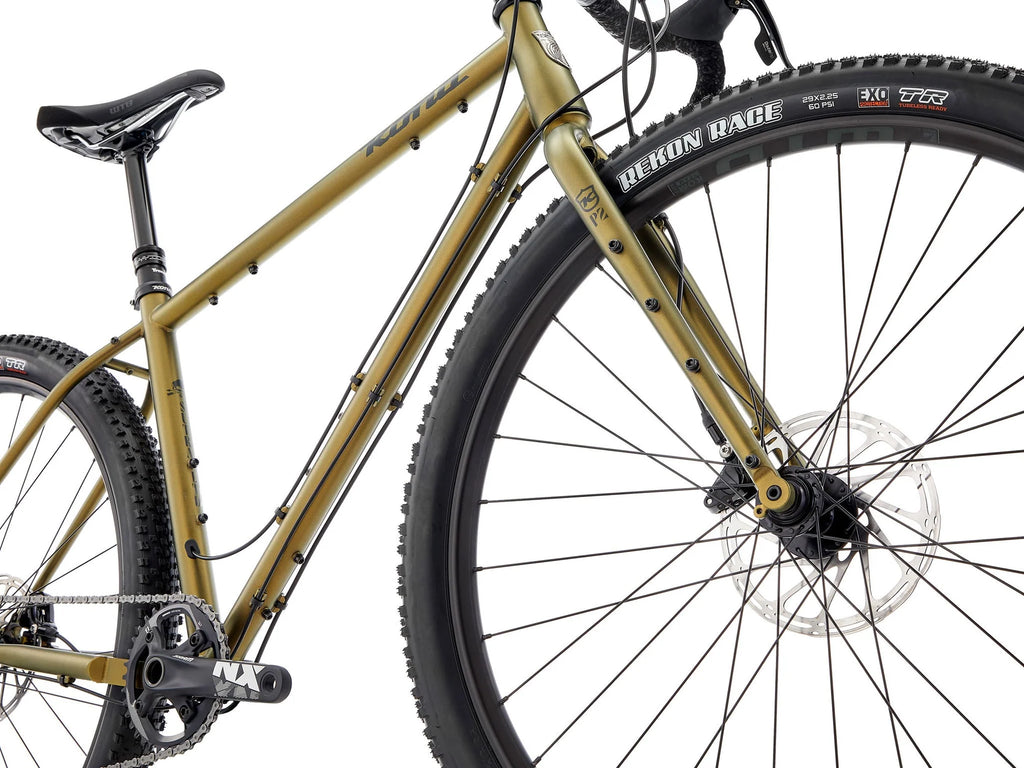 Gold mountain bike with black tires on a white background