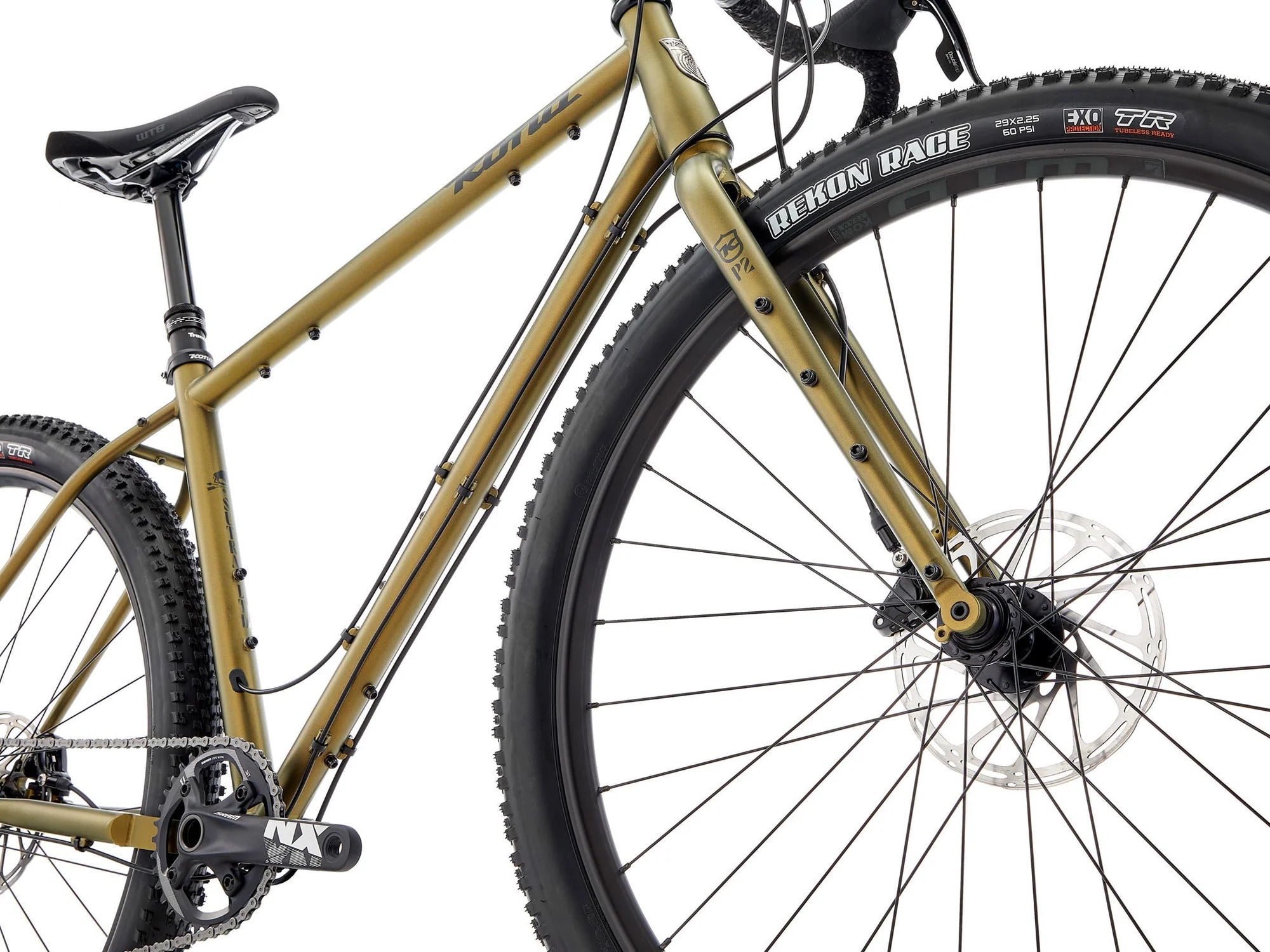 Gold mountain bike with black tires on a white background