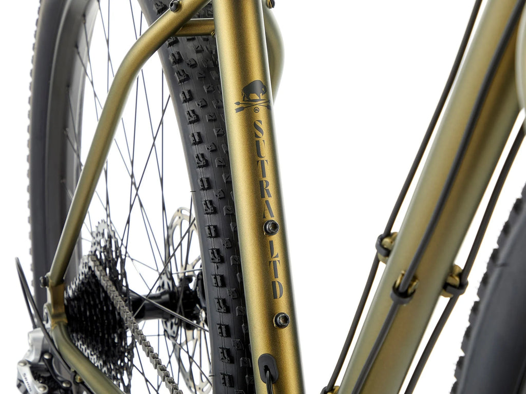 Close-up of a bicycle tire with 'Sutra' branding on a white background