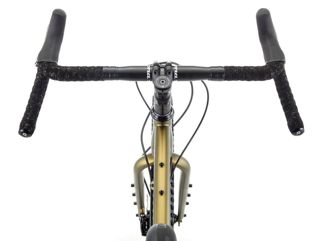 Front view of a gravel bicycle with a matte gold frame, black drop handlebars wrapped in black tape, and a black headset on a white background.