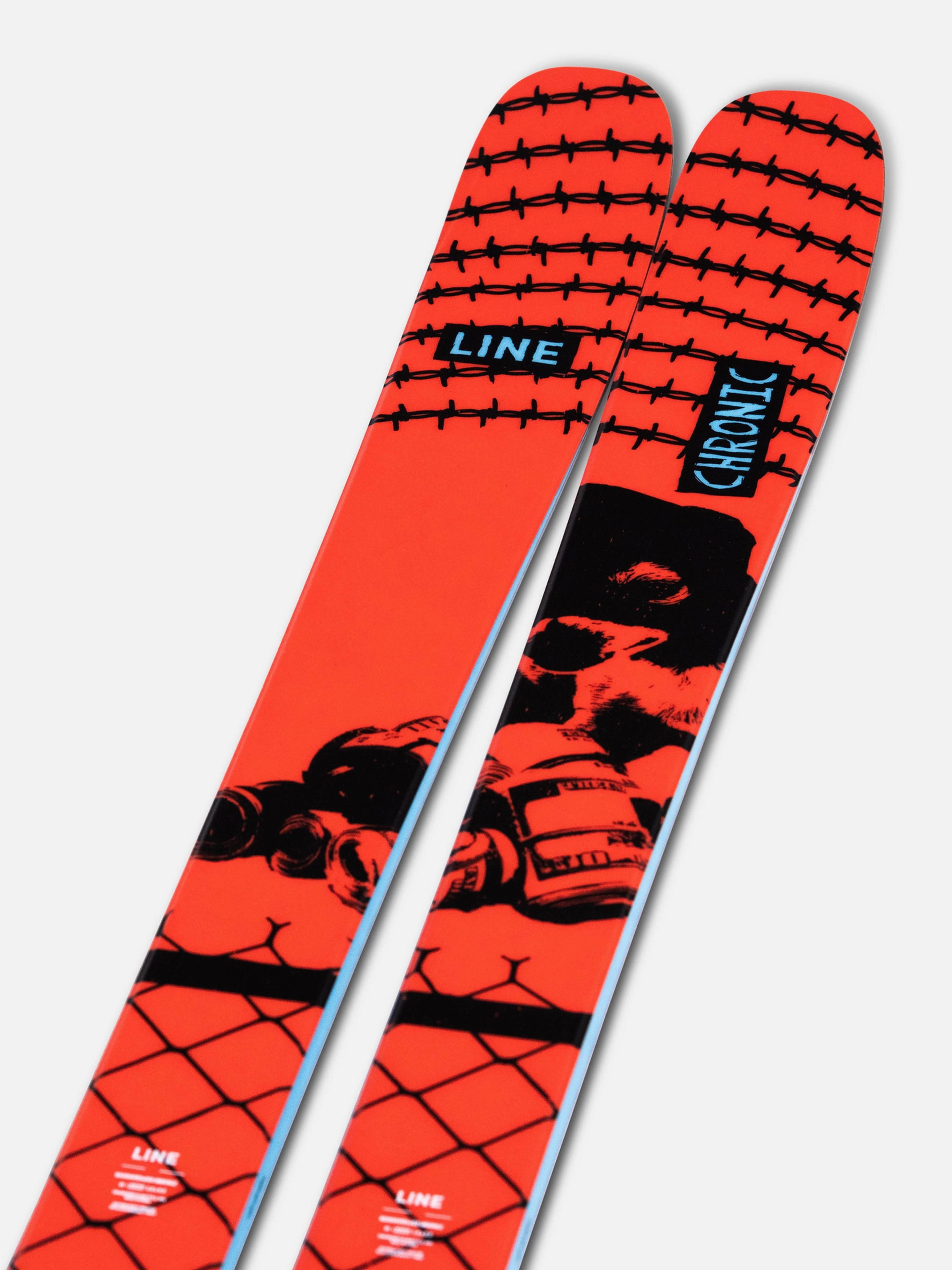 Red and black skis with graphic design on a white background