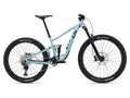 Light blue mountain bike with black tires on a white background
