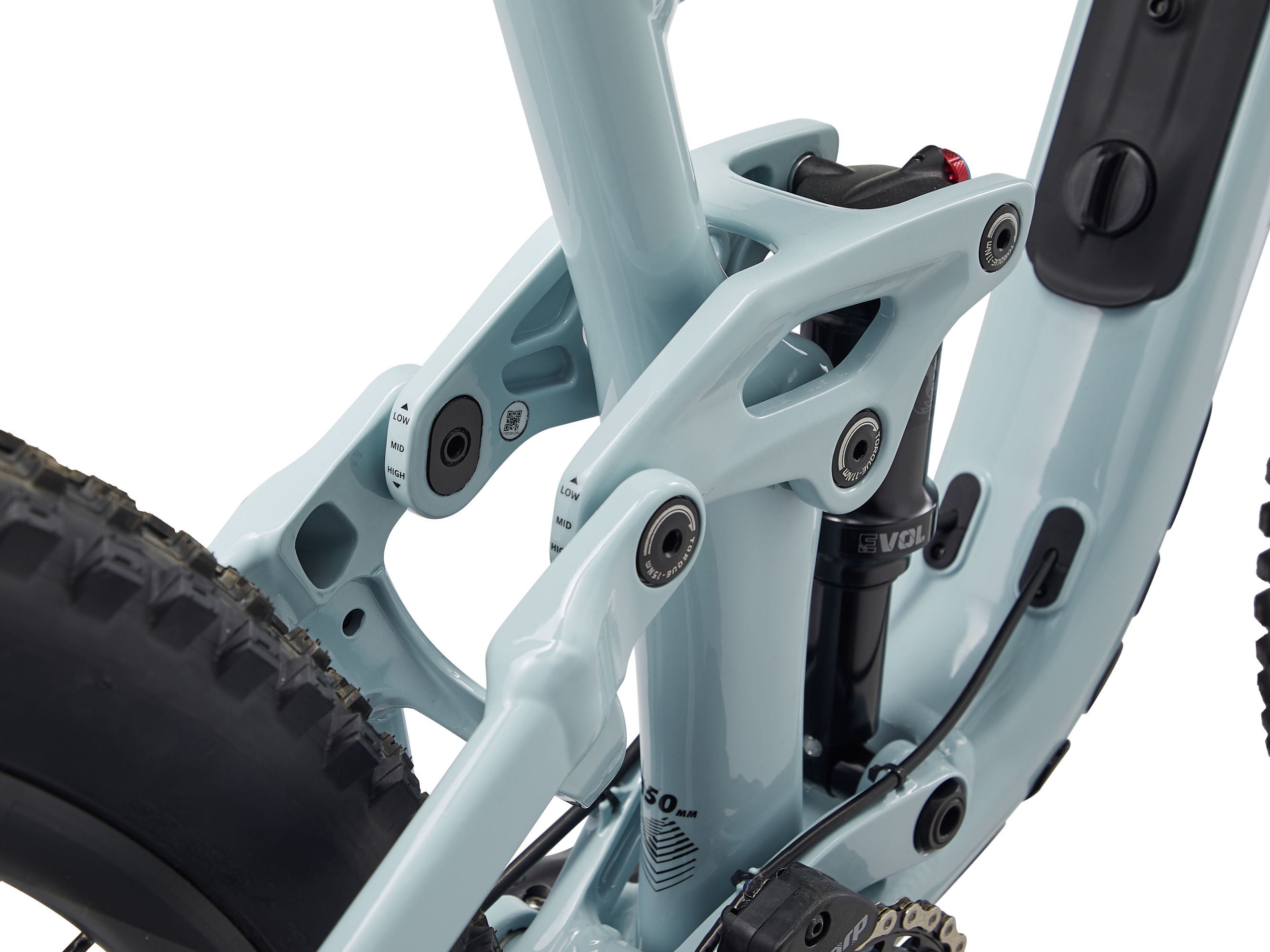 Close-up of a light blue bicycle frame with visible components on a white background