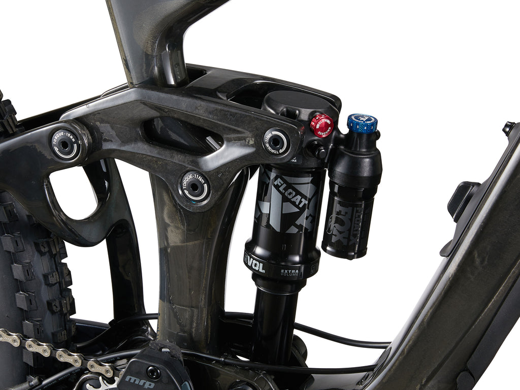 Close-up of a bicycle suspension fork with brand logos on a white background