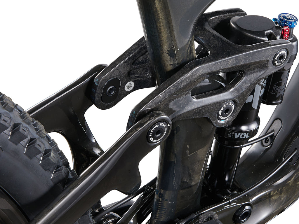Close-up of a motorcycle suspension system with 'Evolve' branding on a white background
