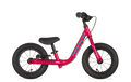 Pink balance bike with black seat on a white background