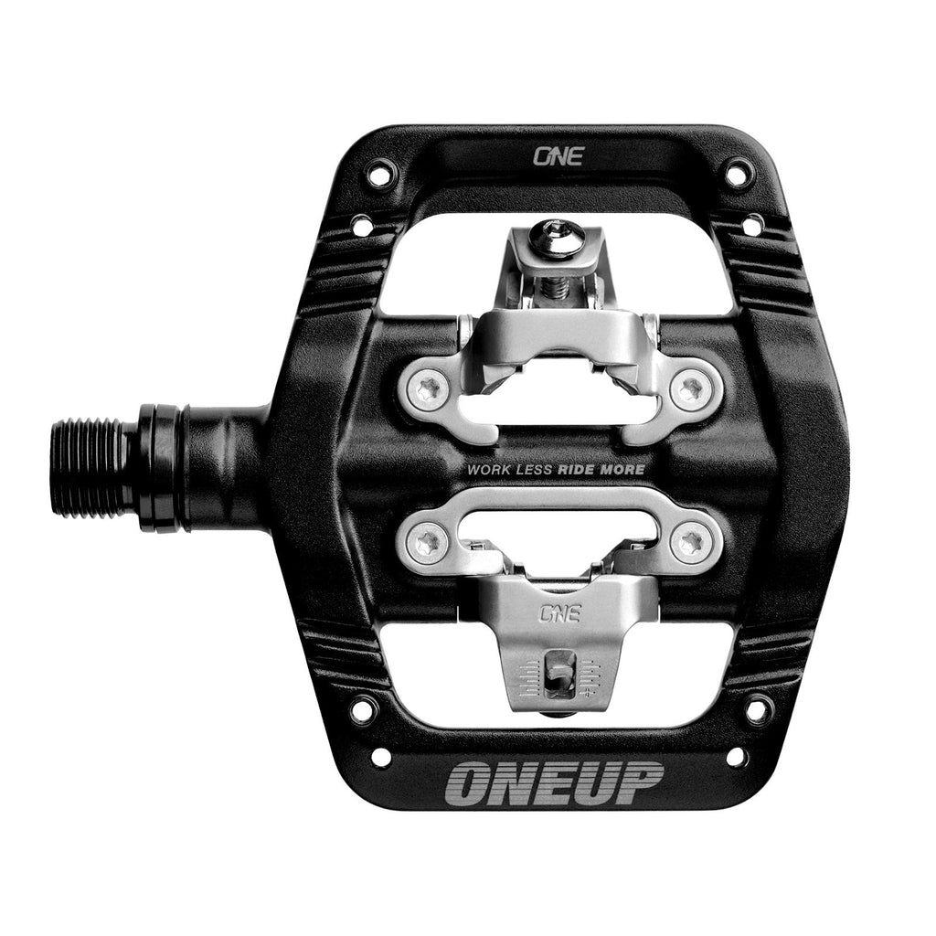 Black and silver OneUp pedal on a white background