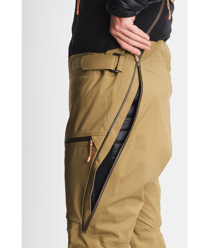 Khaki pants with black accents on a white background