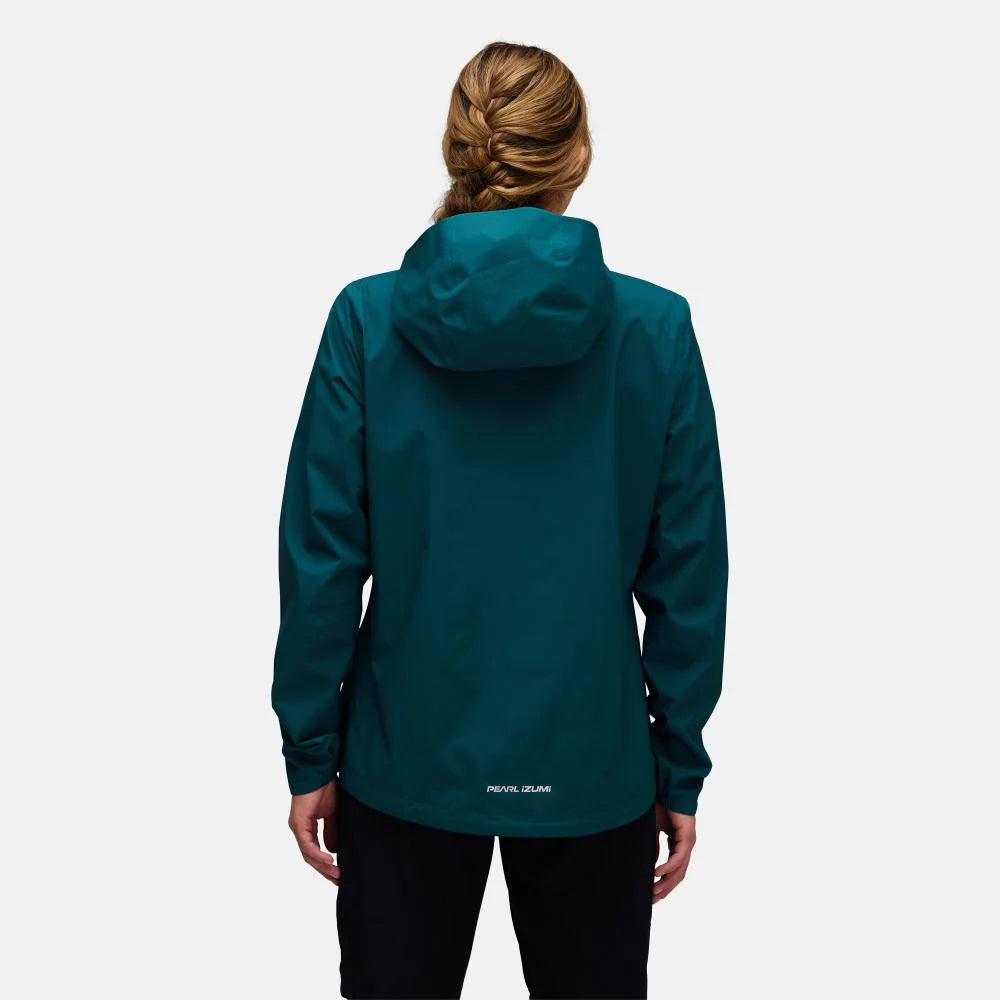 Person wearing a teal jacket on a white background