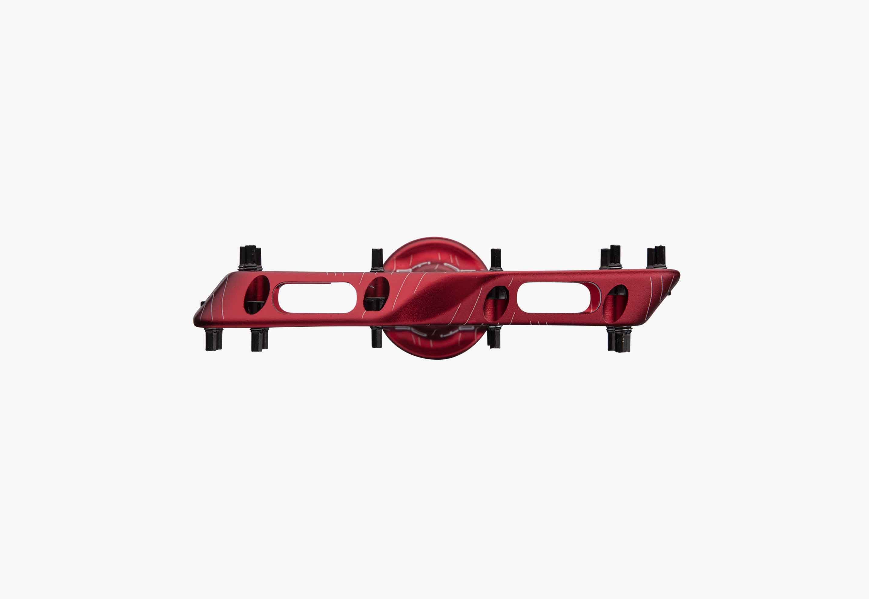 Red metal component on a white background