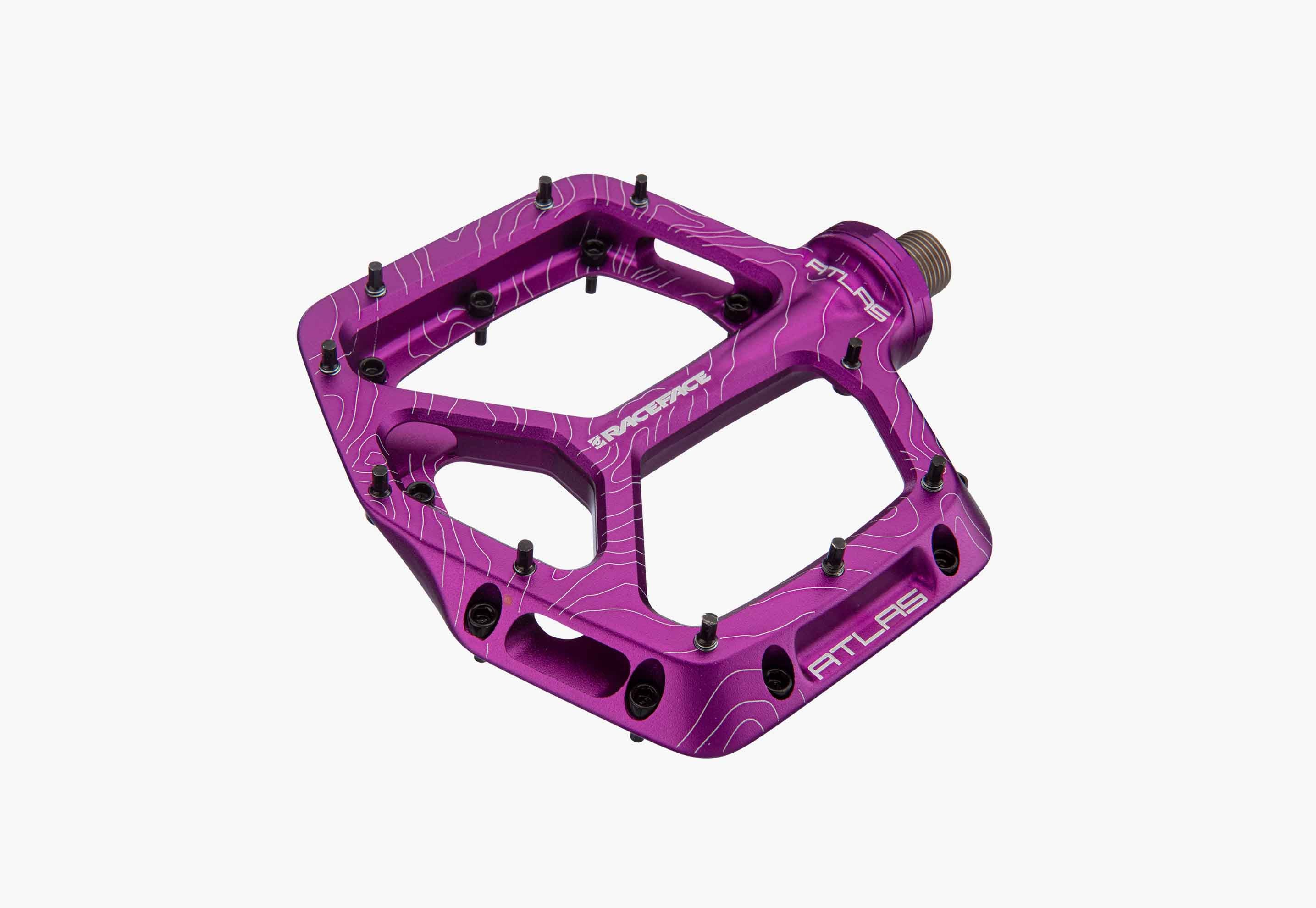 Purple bicycle pedal on a white background