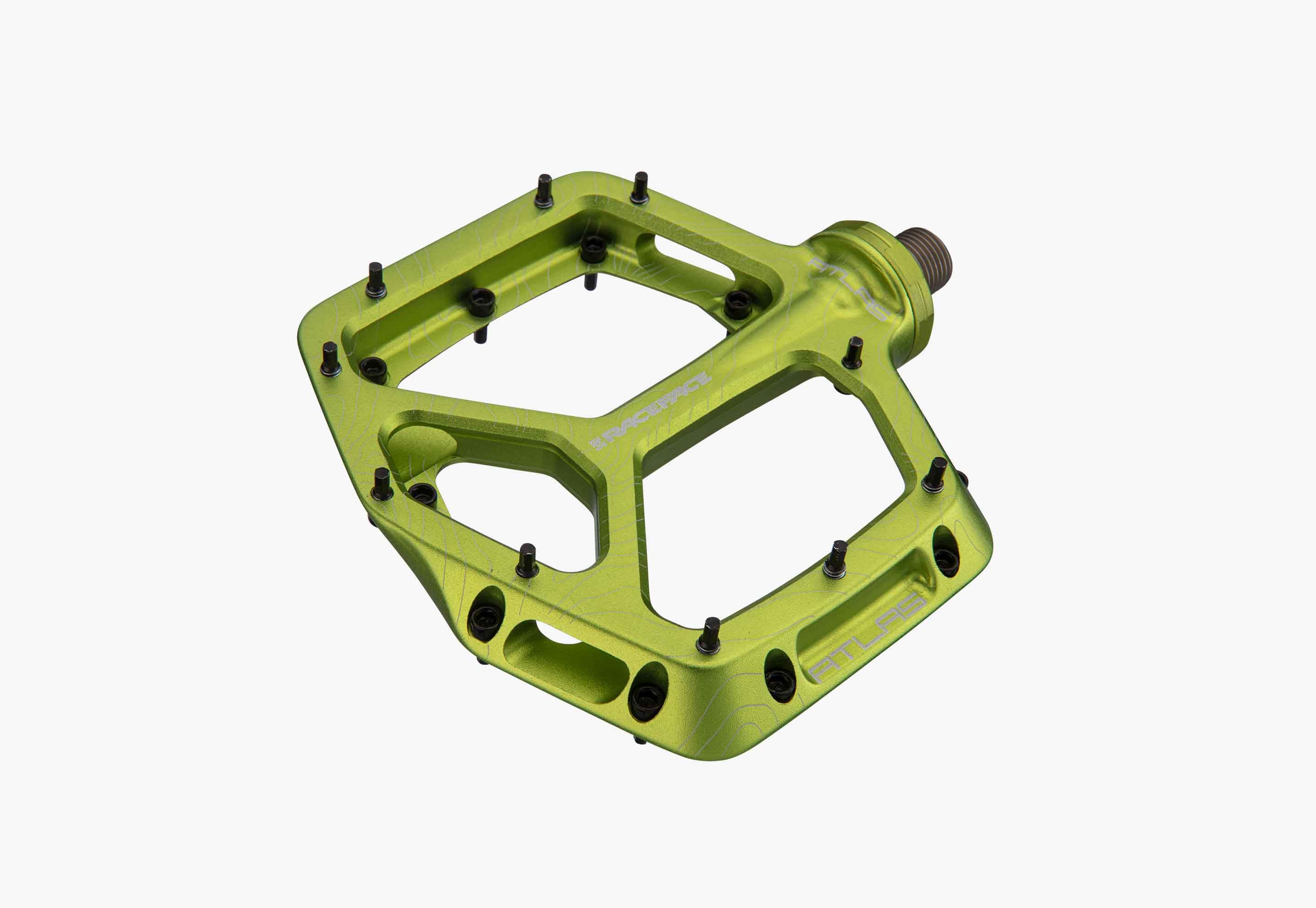 Green bicycle pedal on a white background