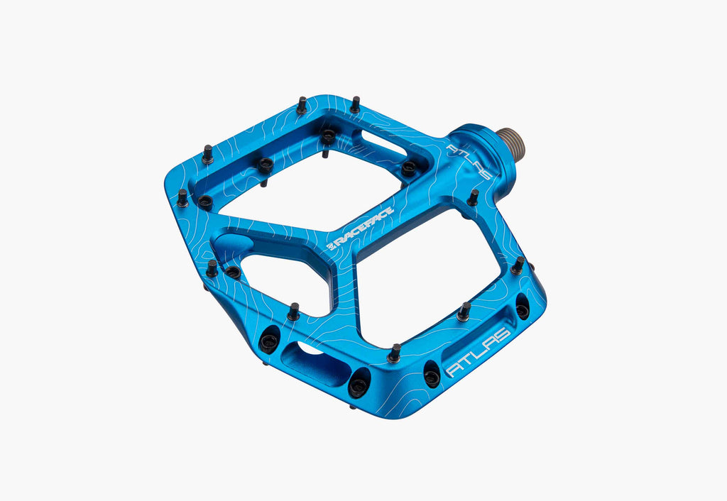 Turquoise bicycle pedal on a white background