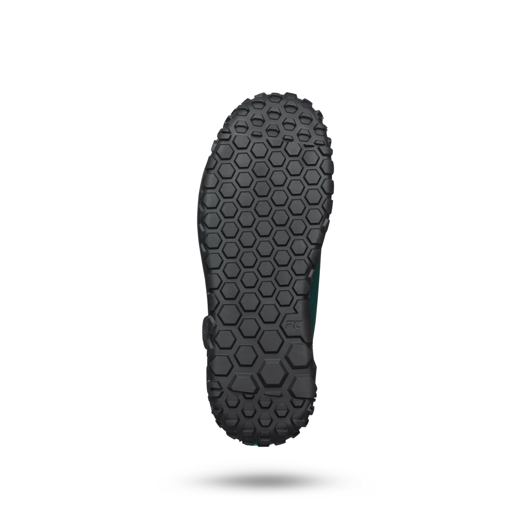 Black sole of a shoe with a textured pattern on a white background