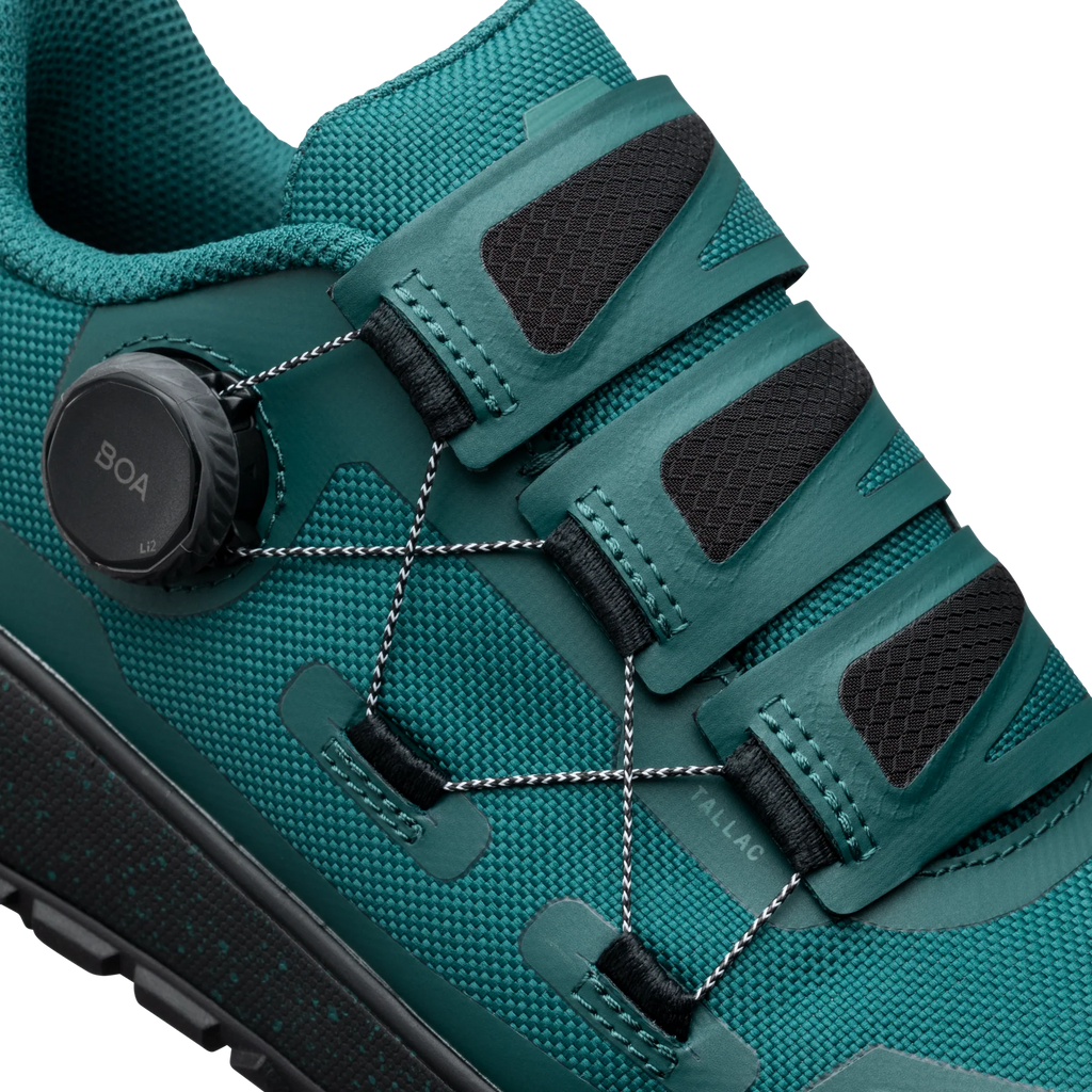 Teal hiking shoe with BOA system on a white background