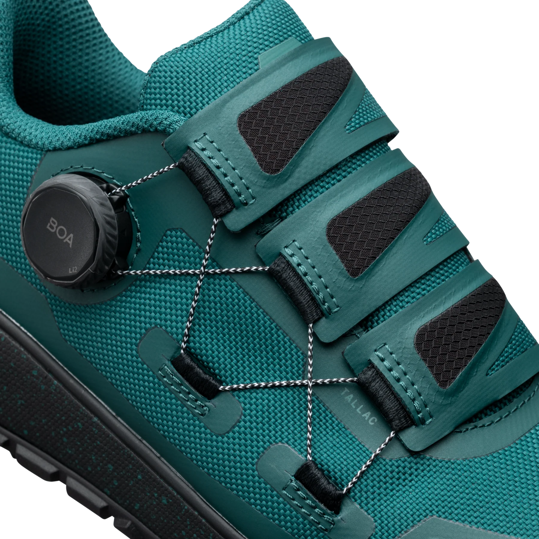 Teal hiking shoe with BOA system on a white background