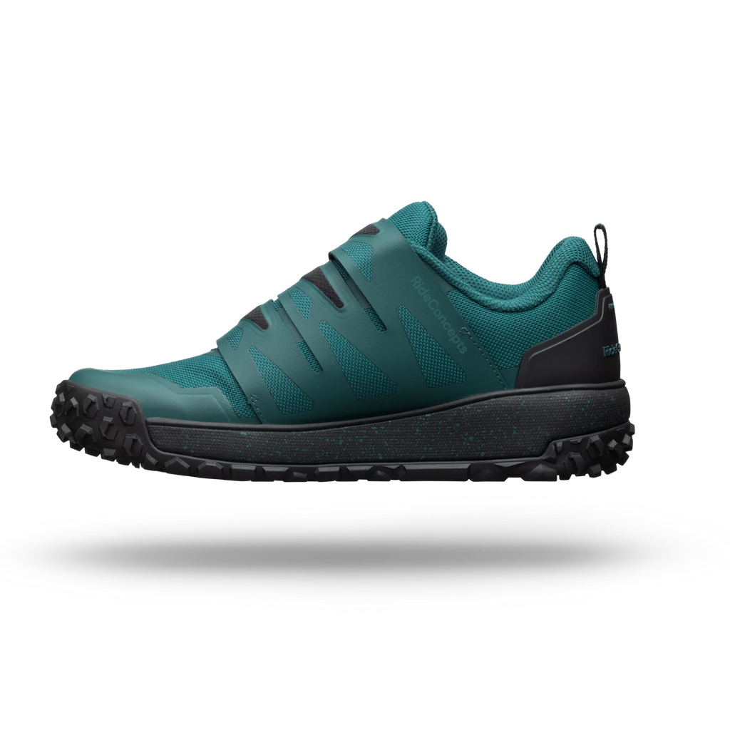 Teal hiking shoe with black sole on a white background