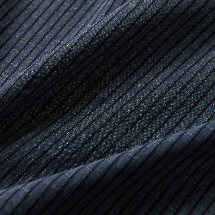 Close-up of dark blue ribbed fabric texture