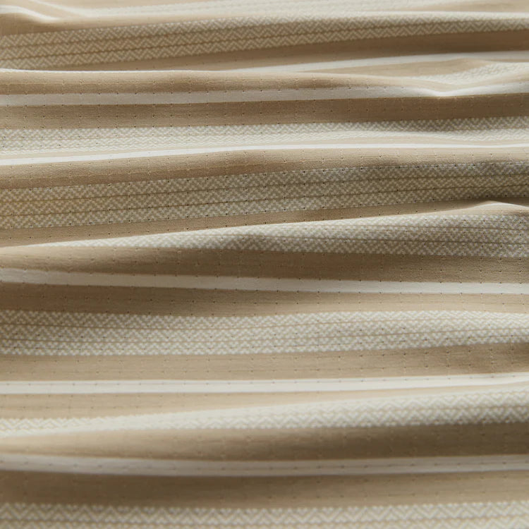 Close-up of beige and white striped fabric texture