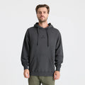 Man wearing a dark gray hoodie with a brand logo on a light gray background