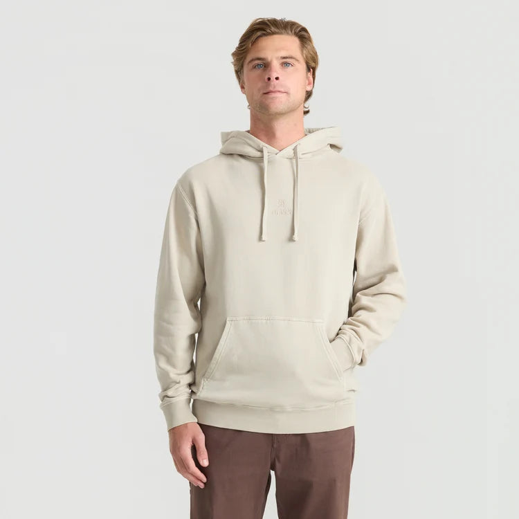 Man wearing a beige hoodie on a light gray background