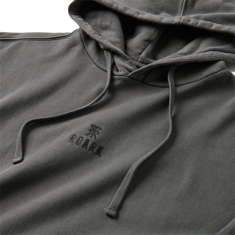 A close-up of a dark gray hooded sweatshirt with matching drawstrings and an embossed 'ROARK' logo on the left chest.