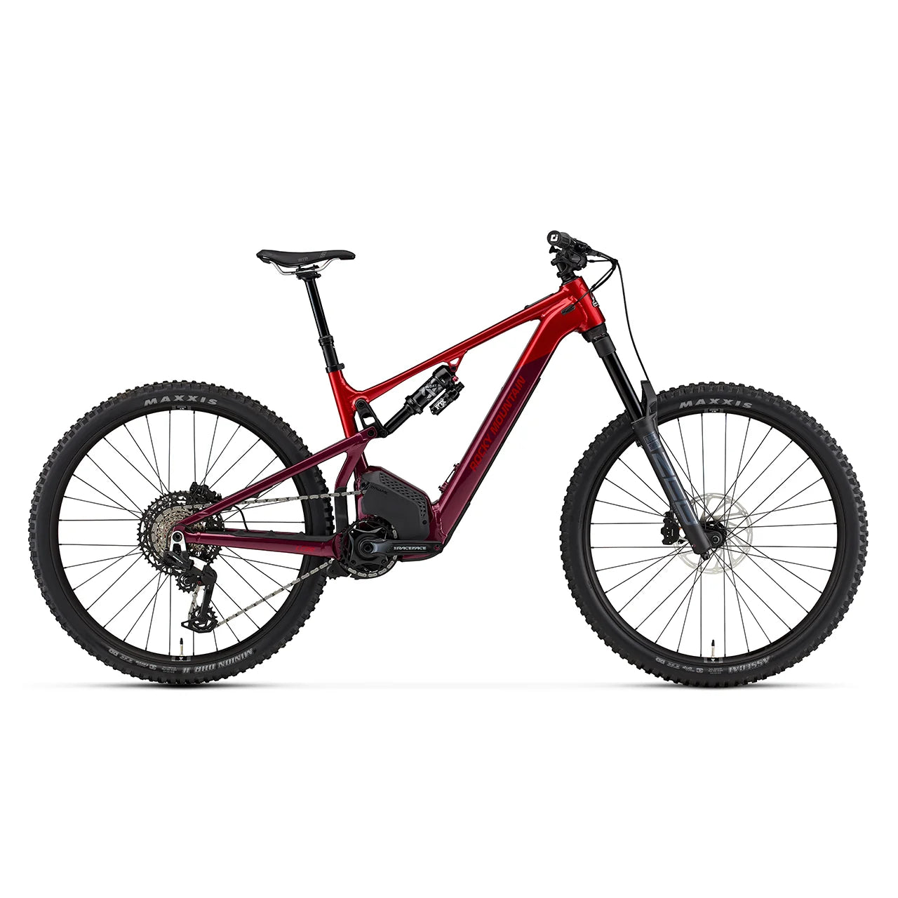 A Rocky Mountain full-suspension mountain bike with a dark teal and black frame, black components, and Maxxis tires, shown from a side profile on a solid white background.