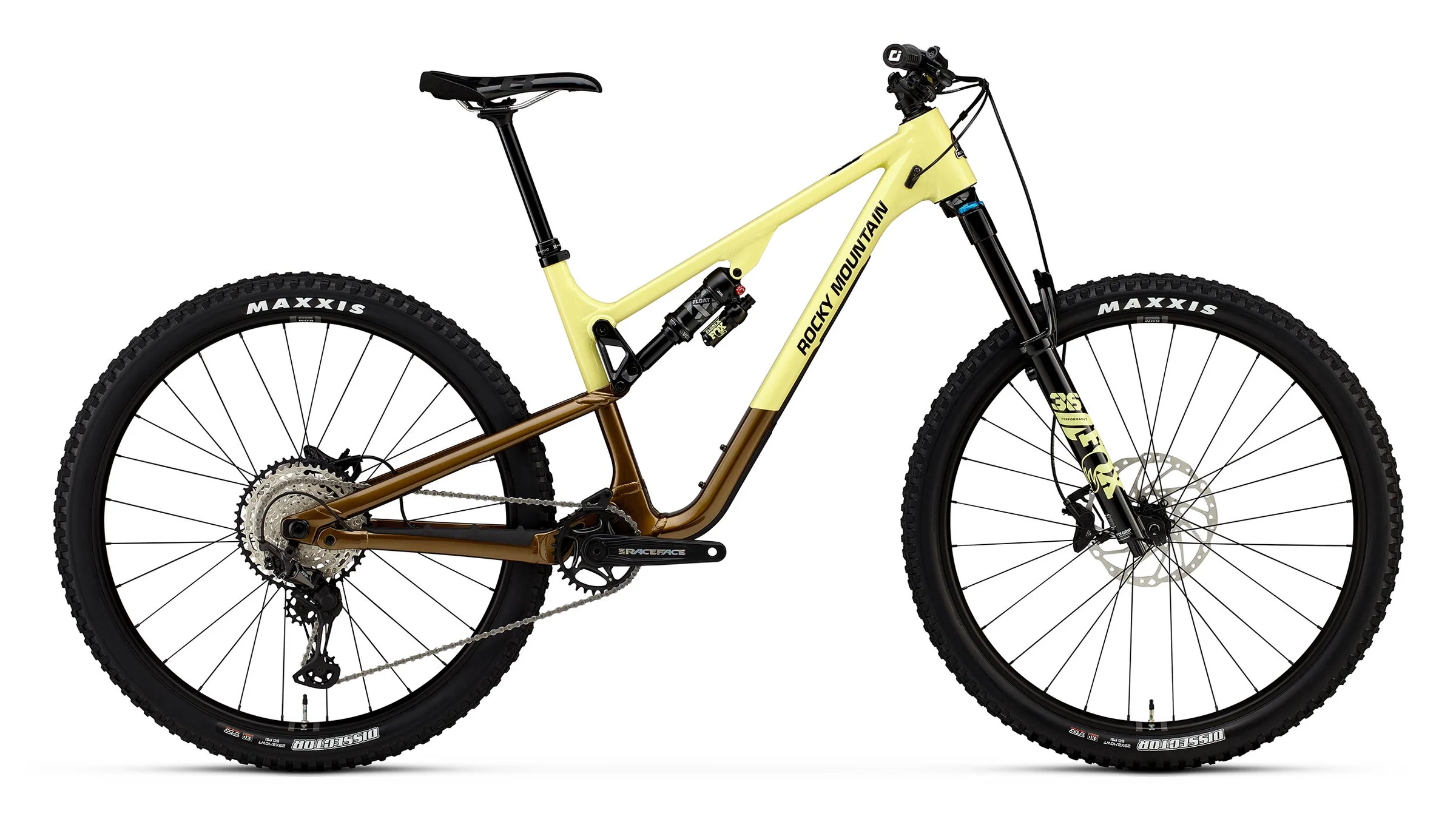 Yellow and brown mountain bike with Maxxis tires on a white background