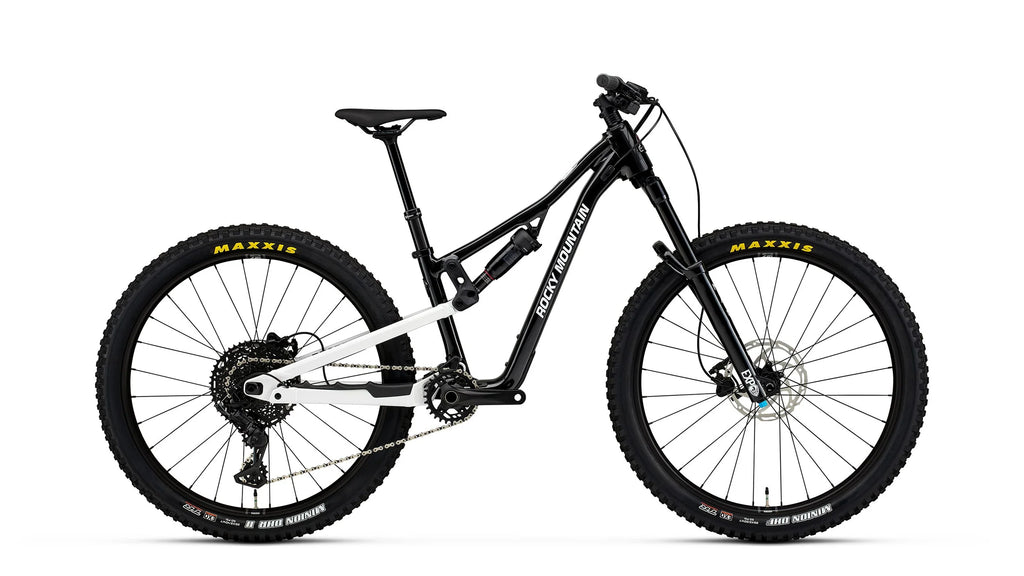 Black mountain bike with Maxxis tires on a white background