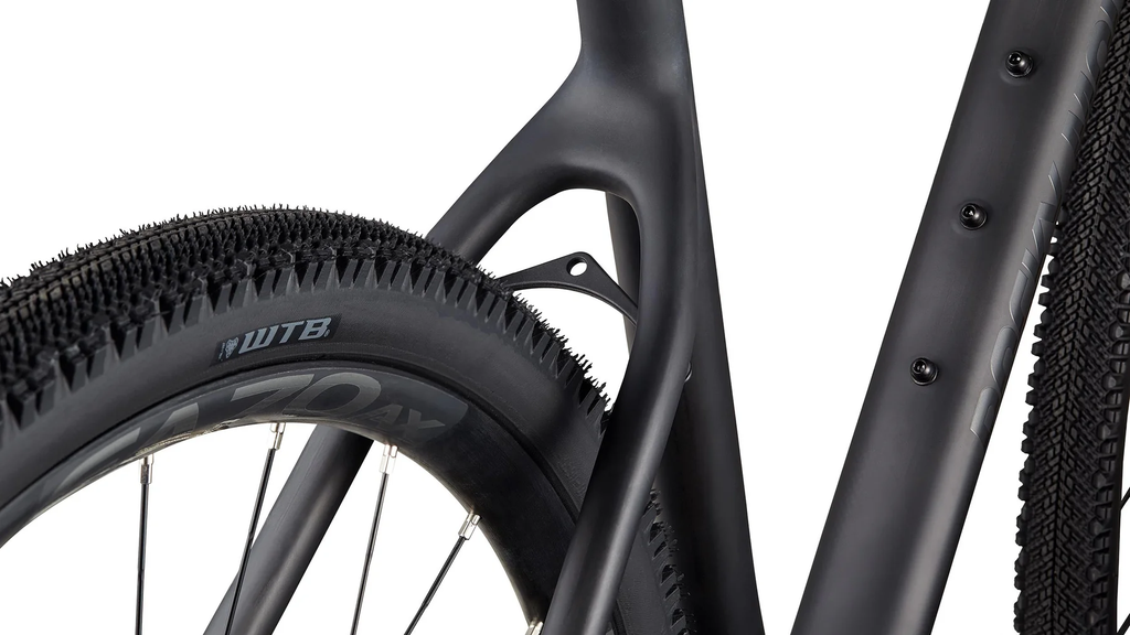 Close-up of a bicycle tire with tread pattern and brand name on a white background