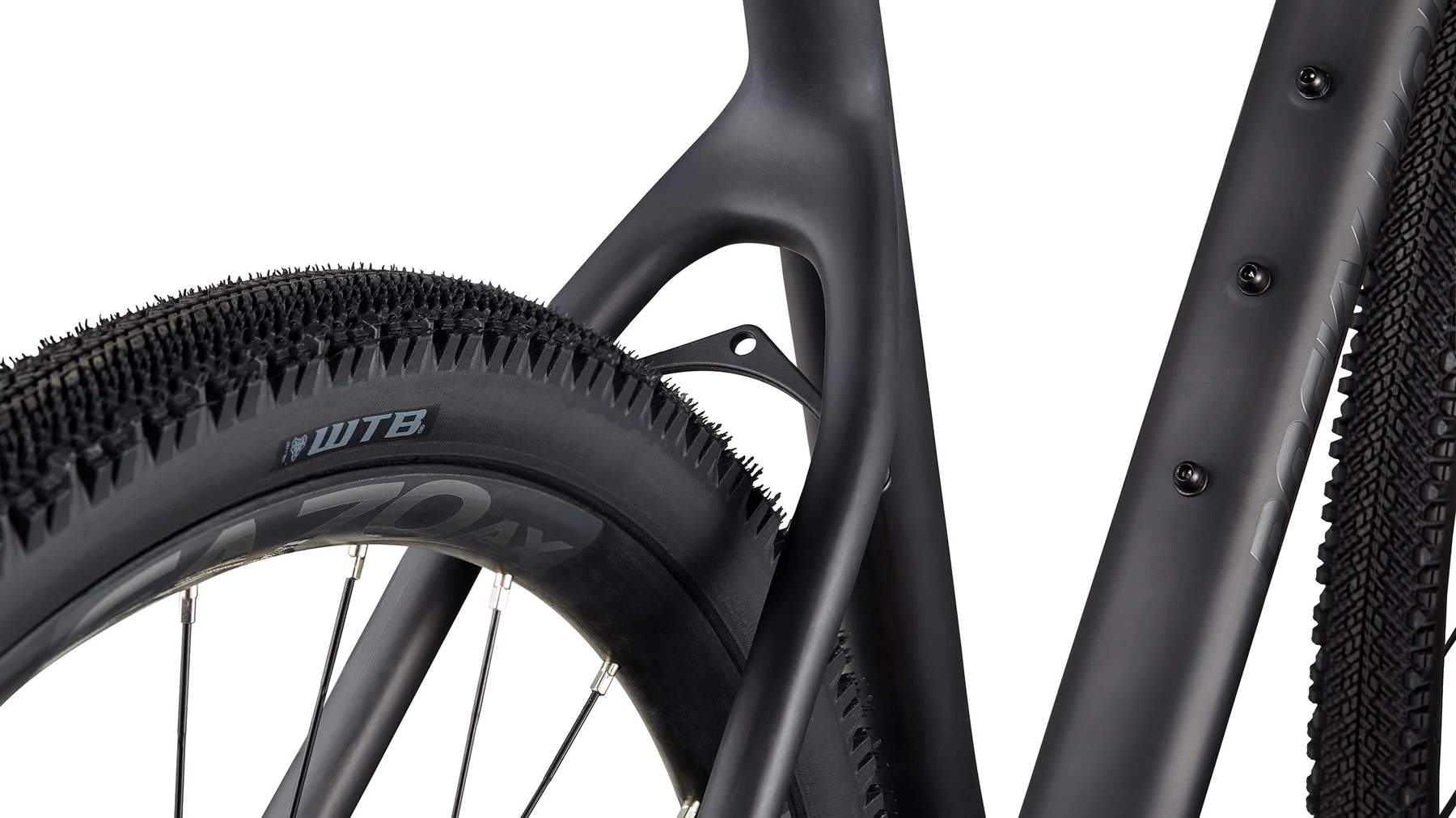 Close-up of a bicycle tire with tread pattern and brand name on a white background
