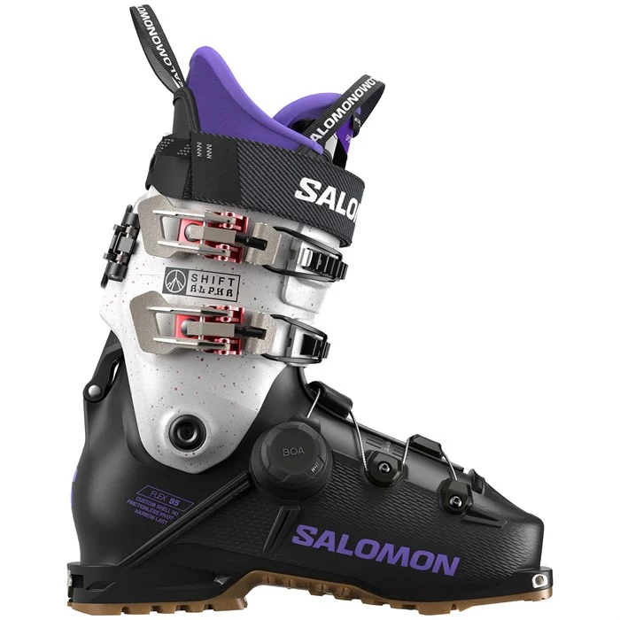 Salomon ski boot with purple and black design on a white background