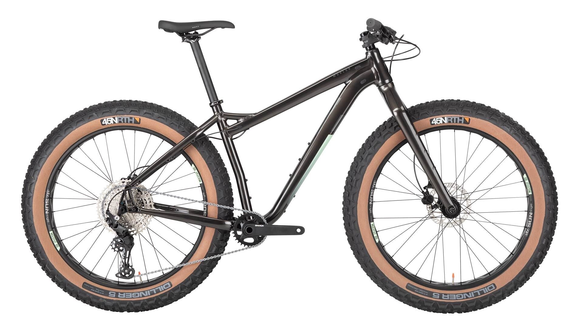 Black mountain bike with brown tires on a white background