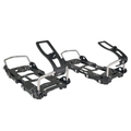 Pair of black snowboard bindings on a white background