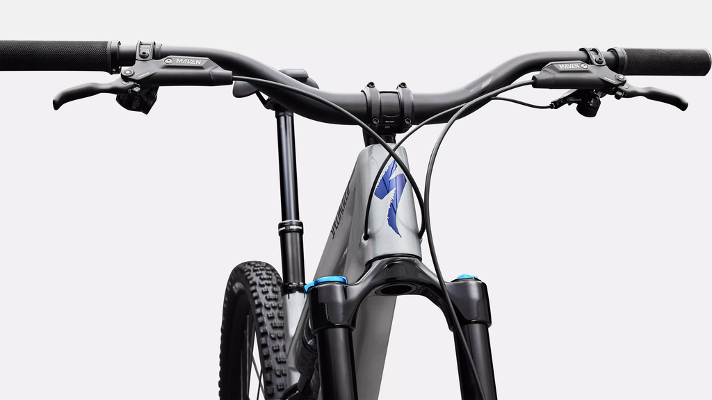 Close-up of a bicycle handlebar with a brand logo on a white background