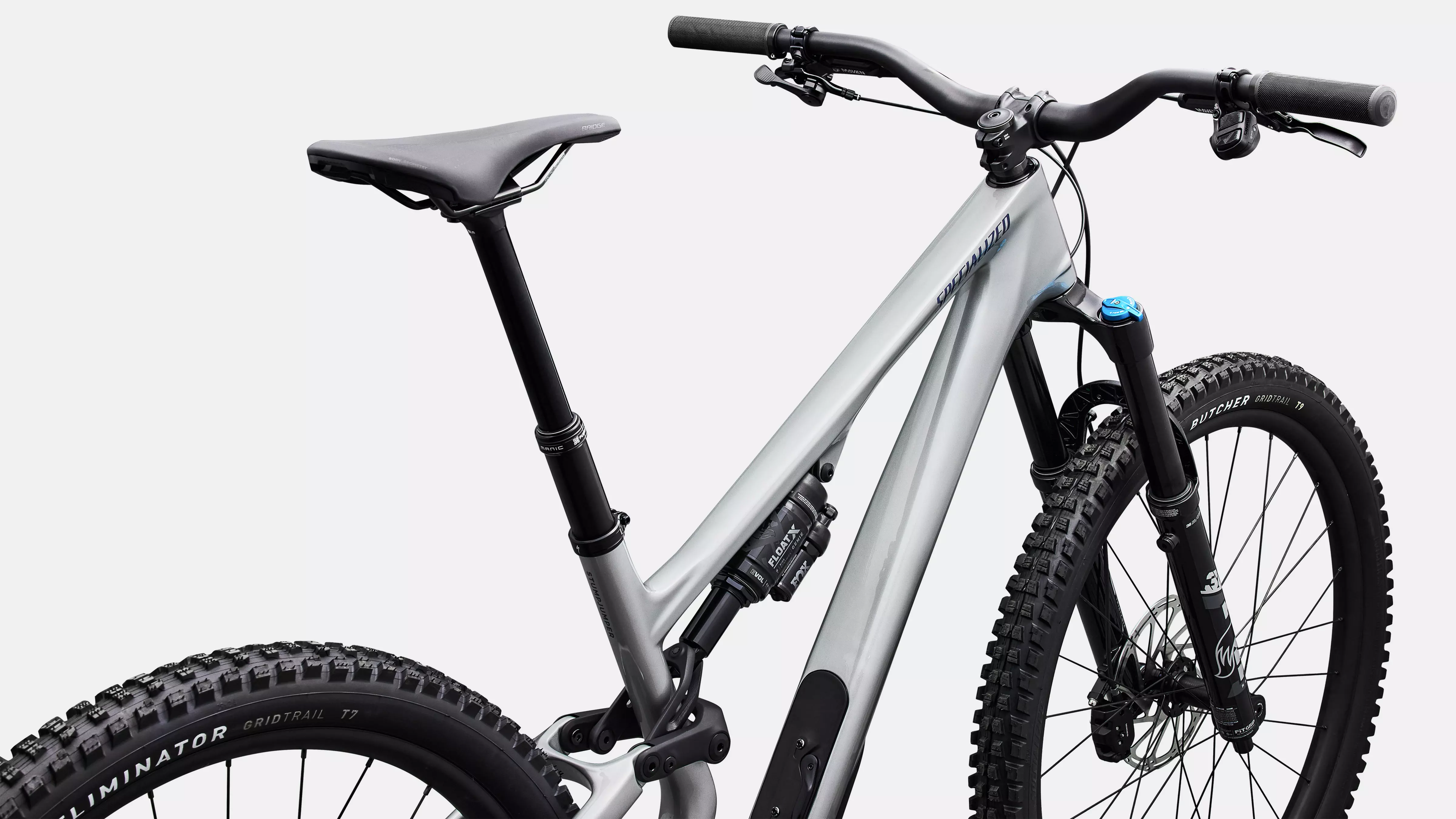 Mountain bike with a white frame and black components on a light gray background
