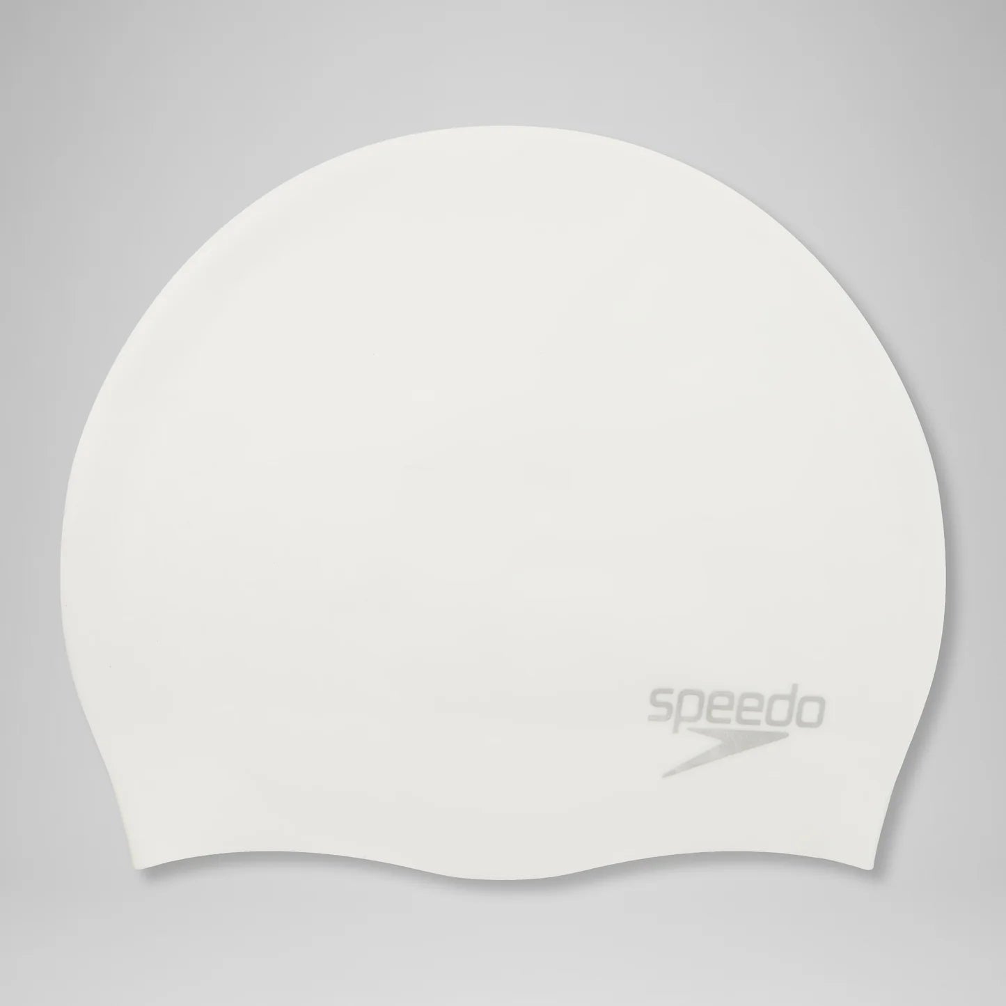 A white Speedo swim cap with a gray logo printed on the lower right side, shown against a neutral gray background.