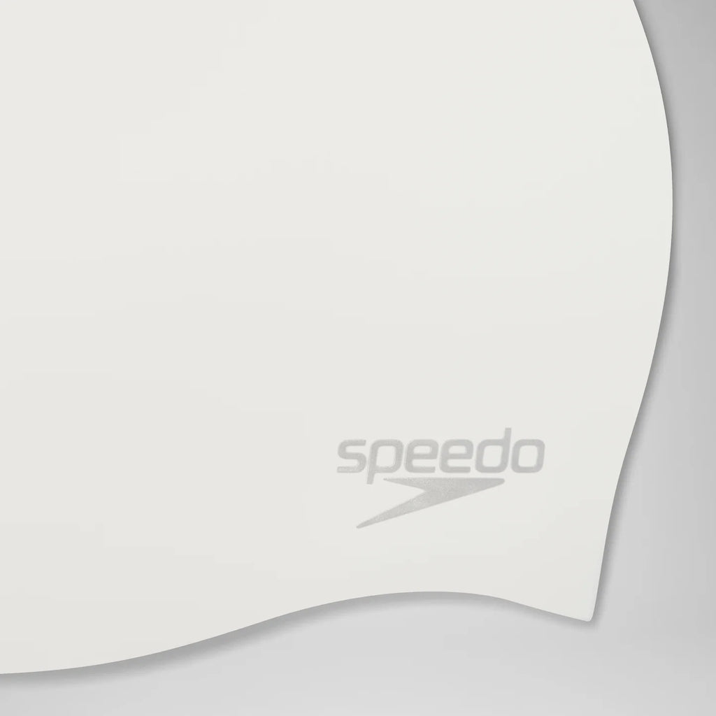 Close-up of a white curved swim cap with the gray Speedo logo near the lower center, shown on a light gray background.