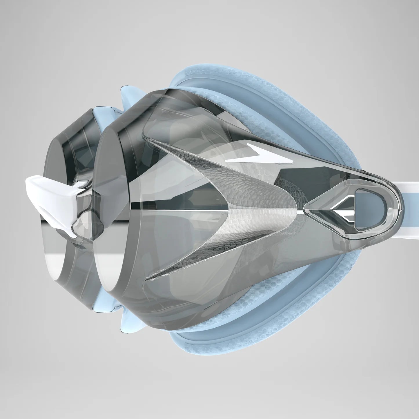 A close-up of a swim goggles with a transparent visor, light blue foam padding, and a white strap on a light gray background.