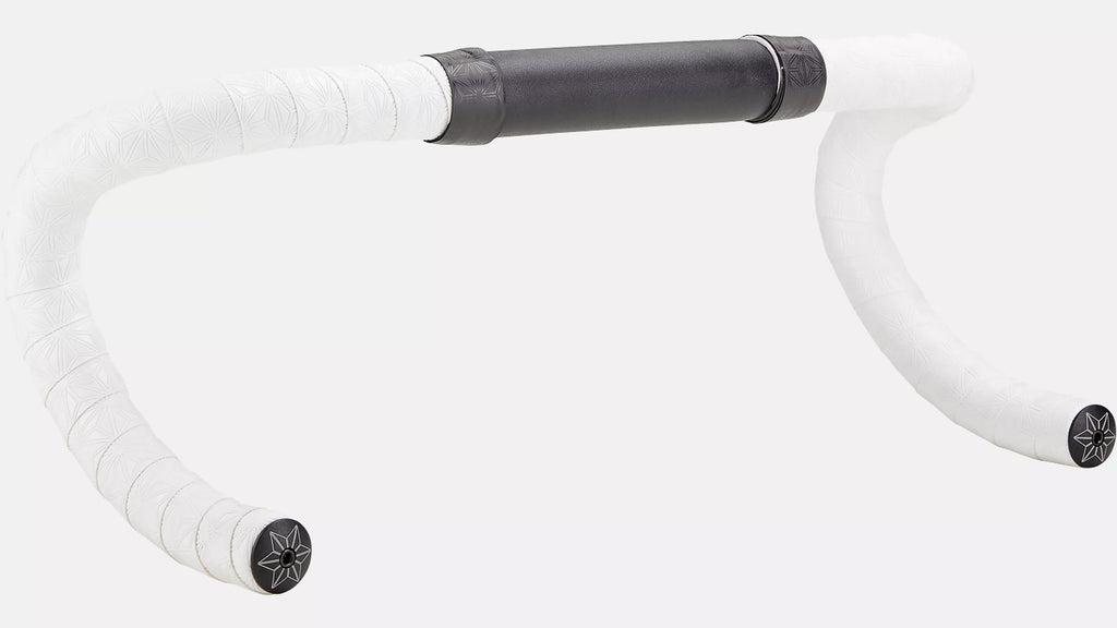 A close-up of a bicycle drop handlebar with white tape wrapped on the curved sections and a black center grip section, shown against a plain light gray background.
